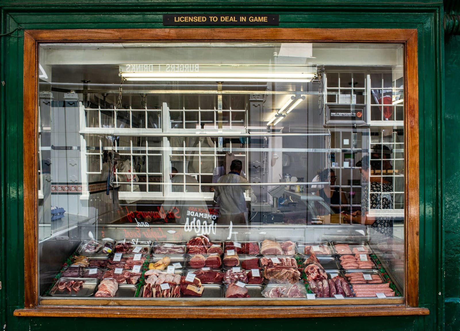 A retail butcher's counter with fresh meat on display